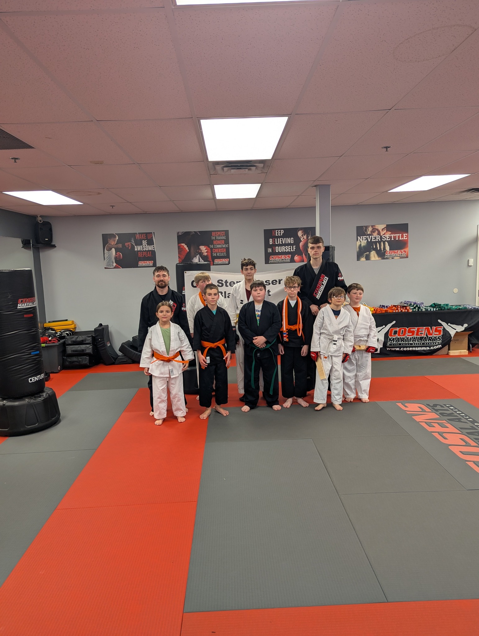 Children smiling during martial arts class at Cosens Martial Arts in Fenton