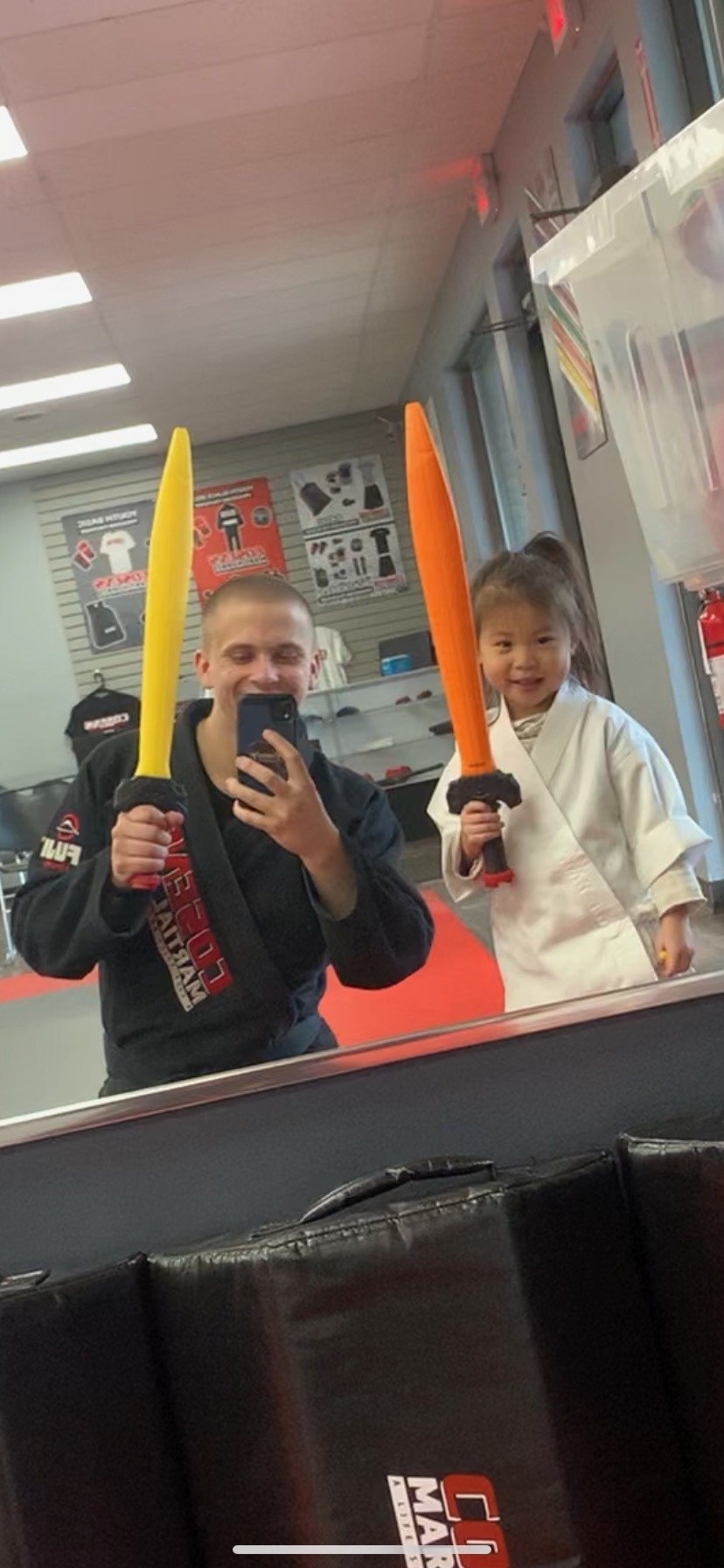 Coach and Tiny Ninjas student practicing together