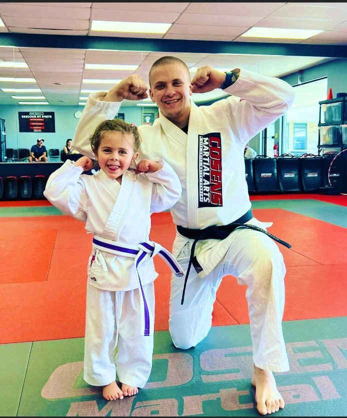 Young Tiny Ninjas student with her coach at Cosens Martial Arts Fenton